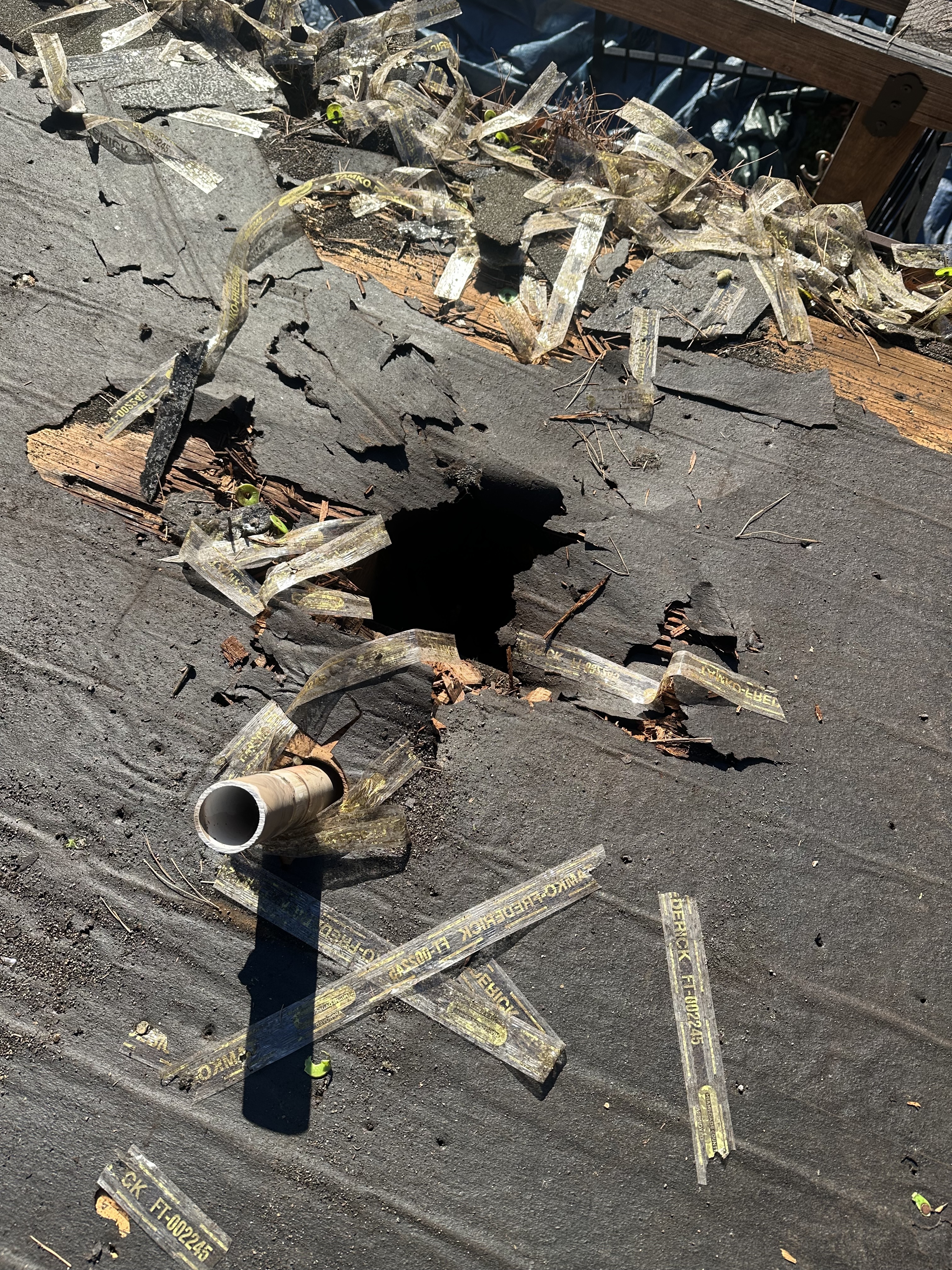 Chimney flashing and wall transition roof damage requiring closer roof repair inspection in North Carolina