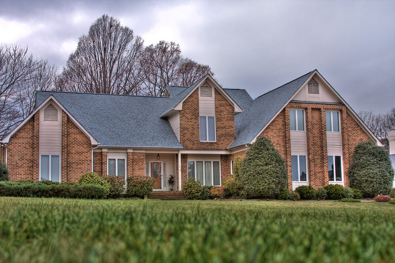 Completed asphalt shingle roof replacement on a home in Gaston County NC