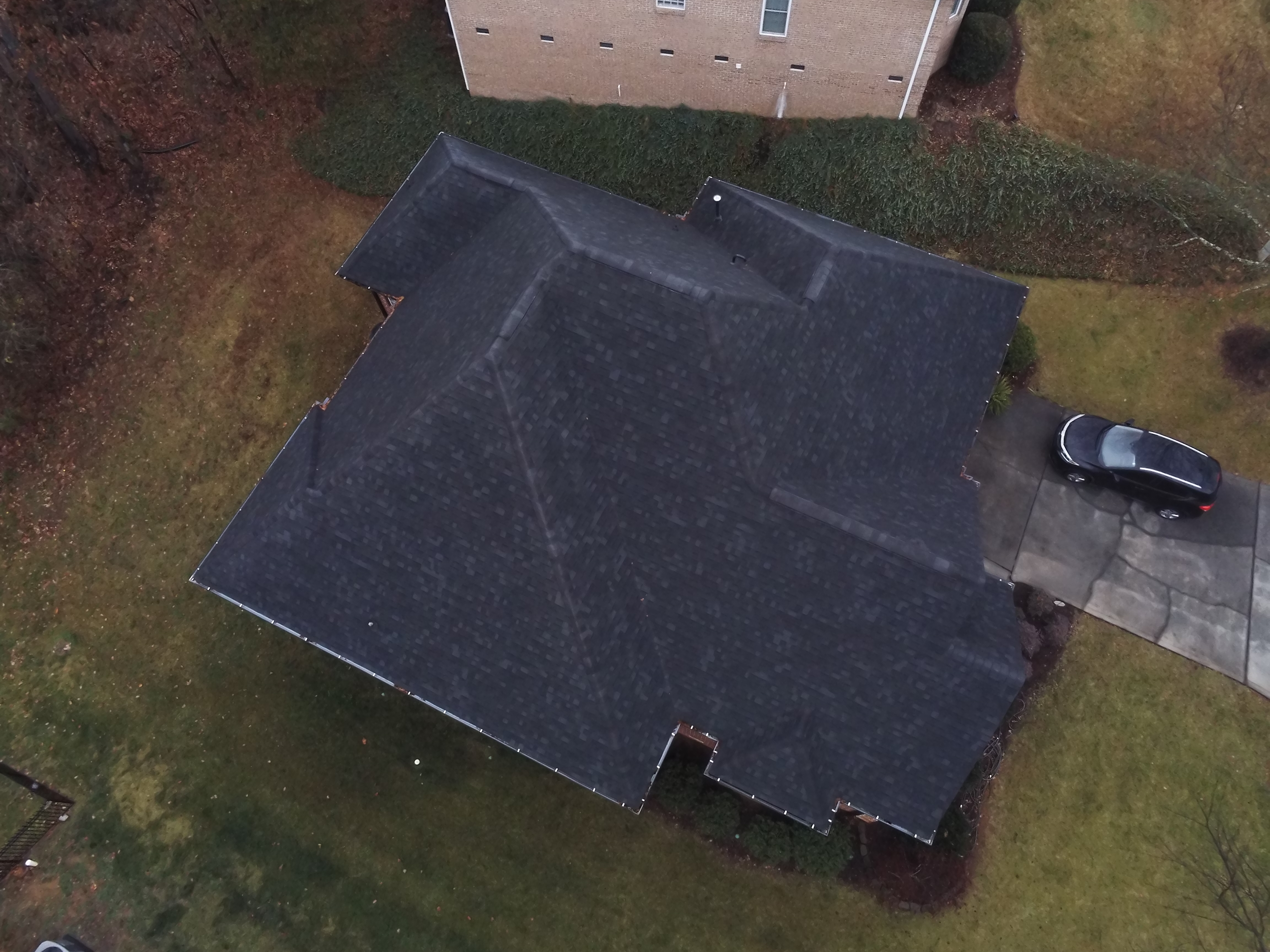 Drone-assisted roof overview during residential leak inspection in Gaston County NC